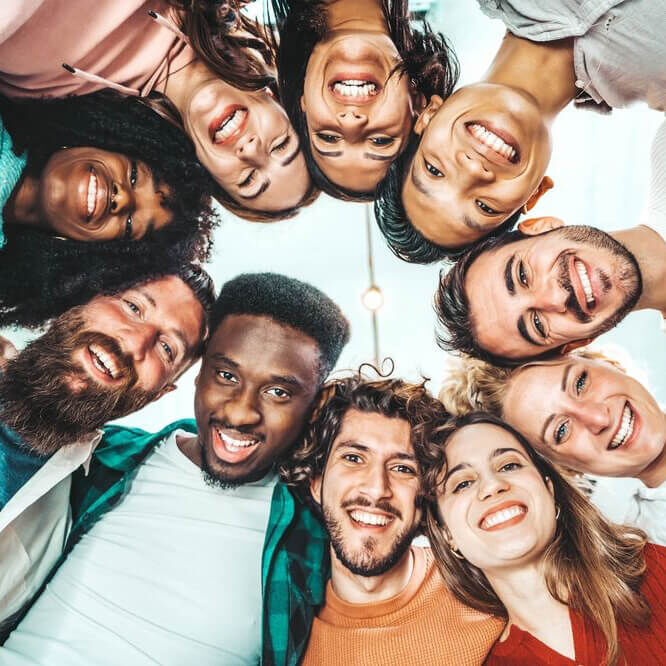 people putting their heads together in a circle